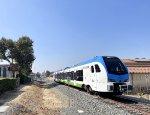 Eastbound Arrow Train approaching the Seventh Street Grade Crossing only a few blocks east of the Redlands-Downtown Station